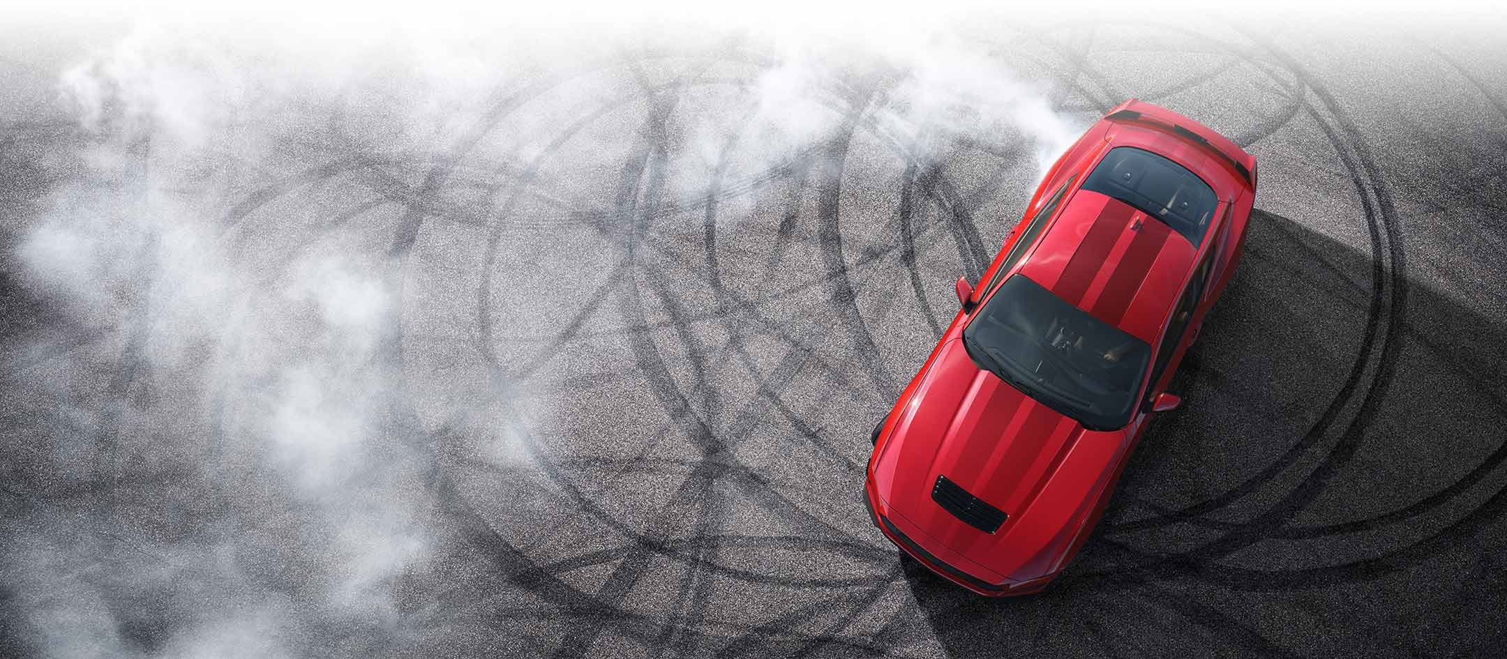 Overhead view of a 2024 Ford Mustang® model with tire tracks on pavement | York Ford Sales in Houlton ME